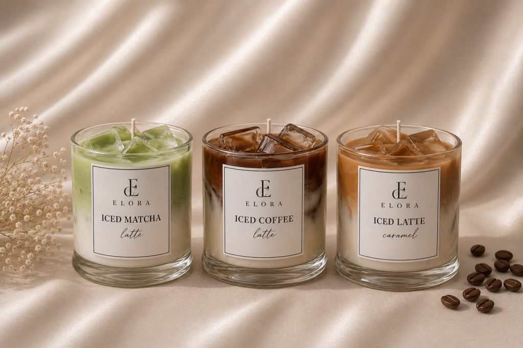 Three cafe-inspired candles arranged on cream satin