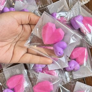 Pink and lilac mini favors in individual clear packaging