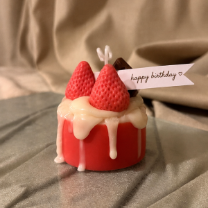Strawberry-topped cake favor with birthday flag